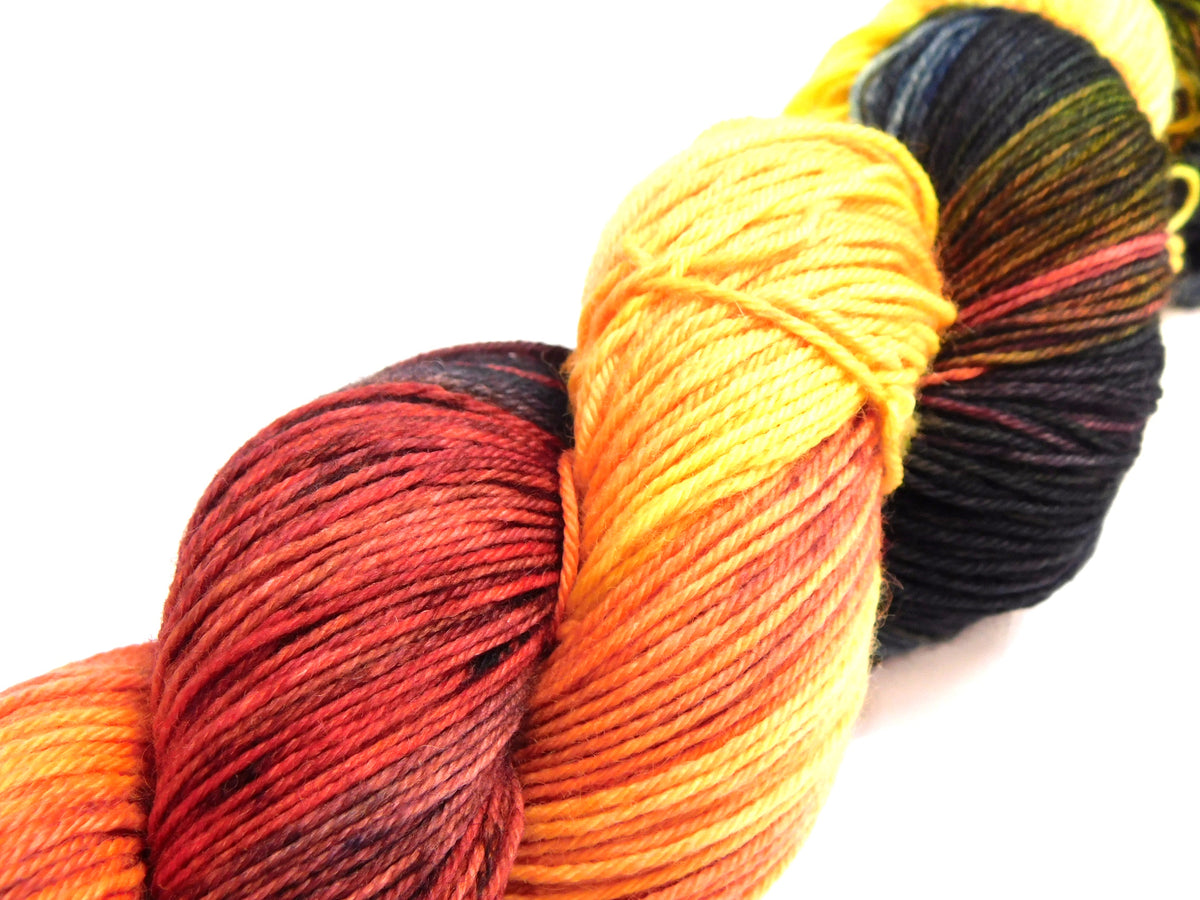 RAMMSKEINS: Till 100g Variegated Yellow Orange Black Sock Yarn Fluorescent/UV Reactive